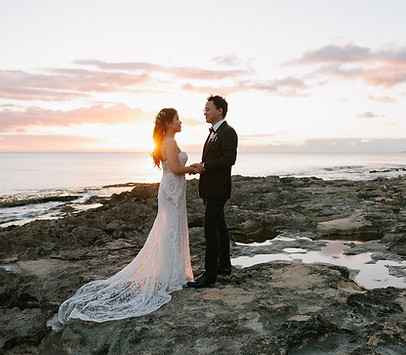 bride and groom with hawaiian sunset